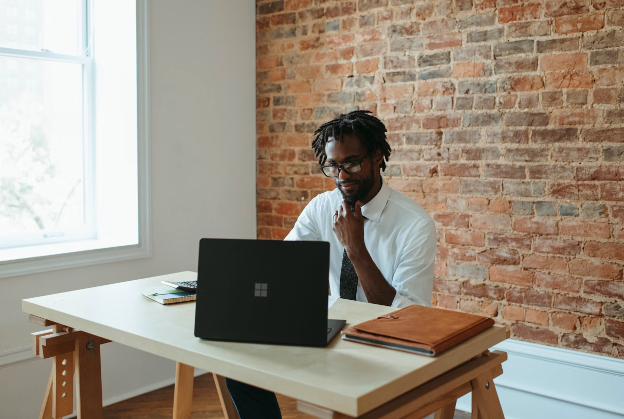 A man working on a dell notebook