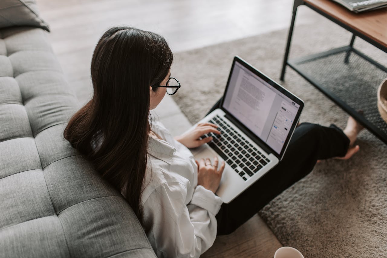 A woman working on a laptop