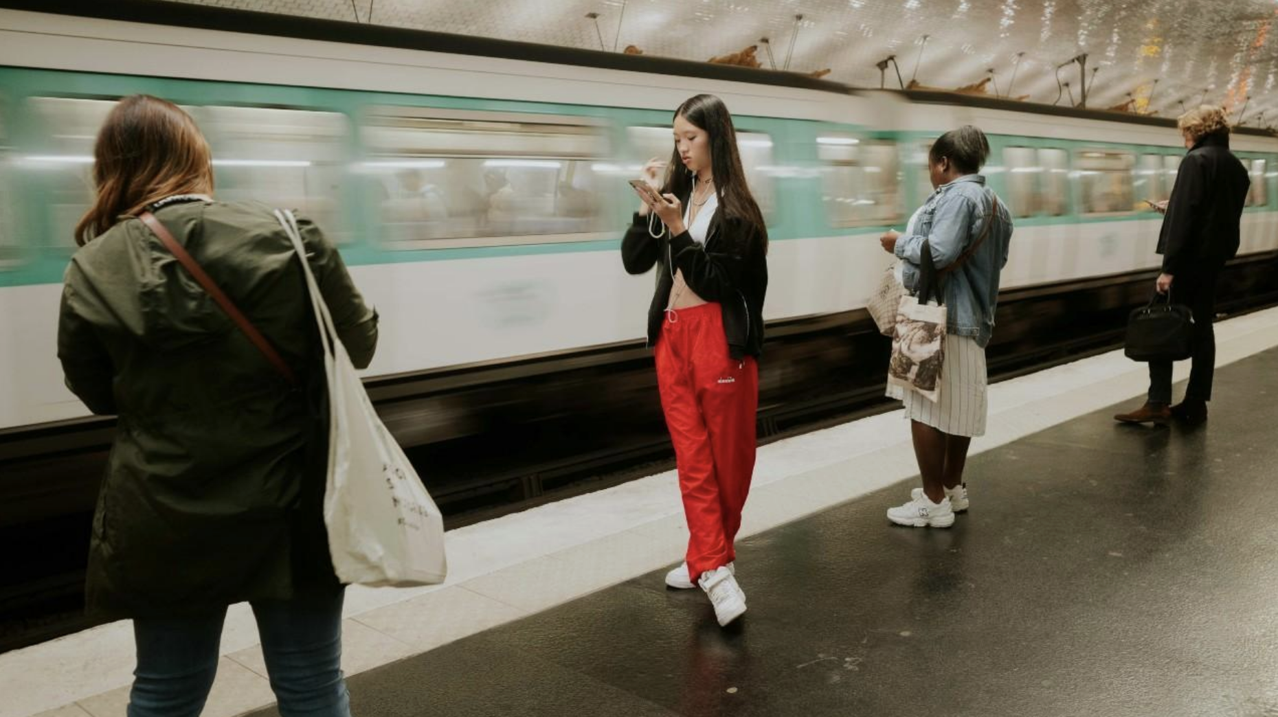 People standing near passing subway