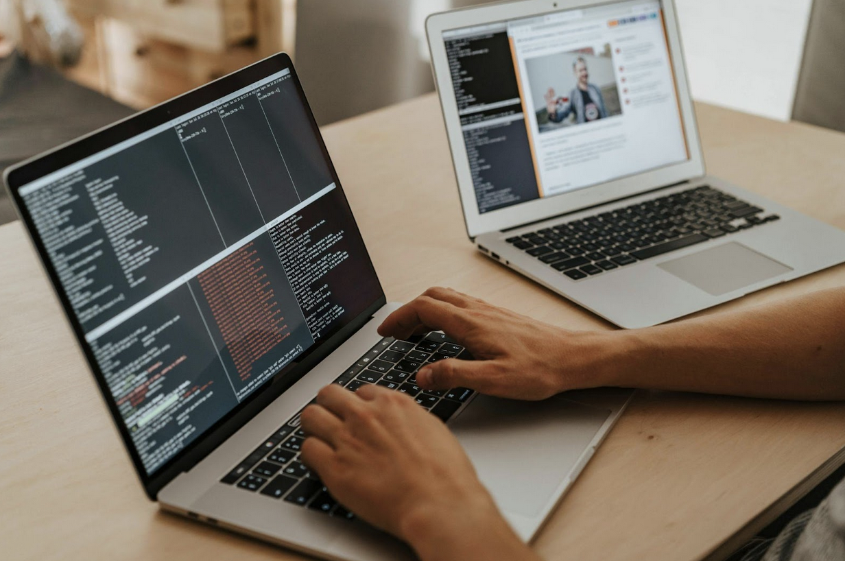 Someone typing on a laptop