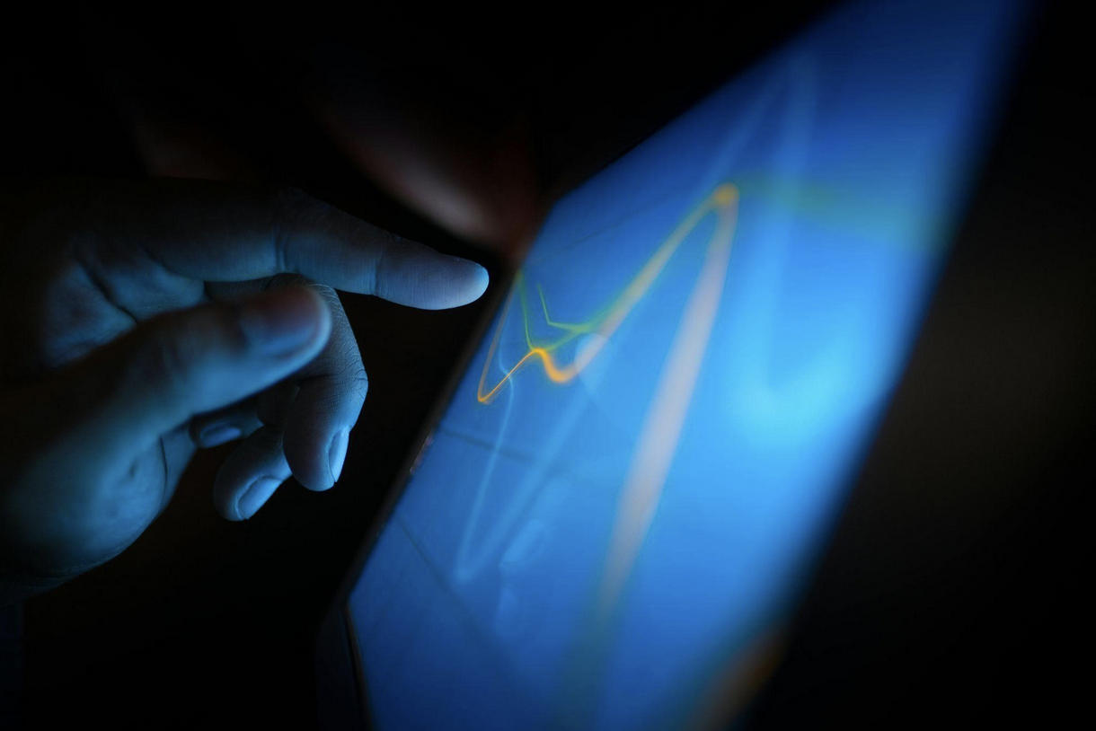 User interacting with digital interface on tablet