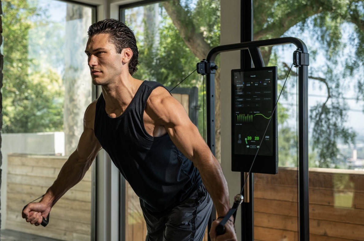 Man using connected fitness equipment