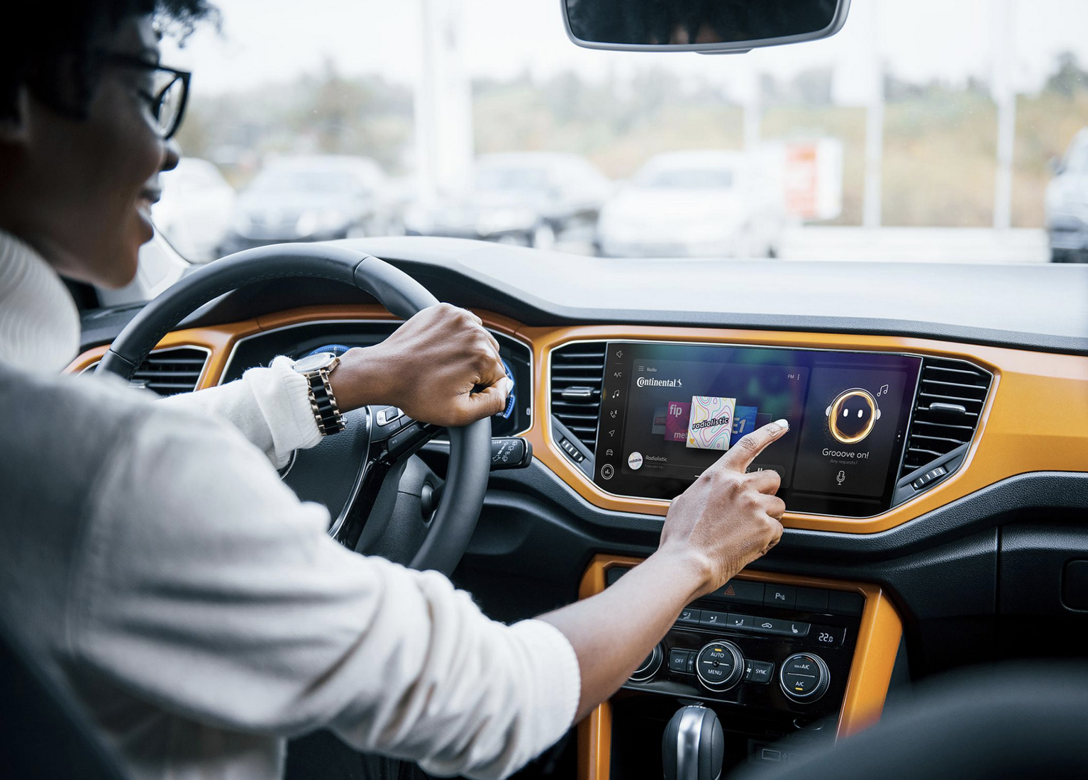 Driver using in-car infotainment touchscreen system