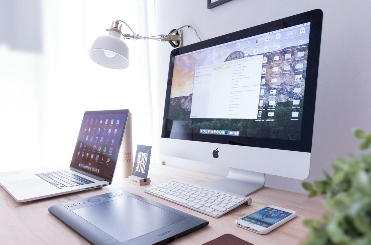 Digital learning workspace with computer, tablet, and smartphone