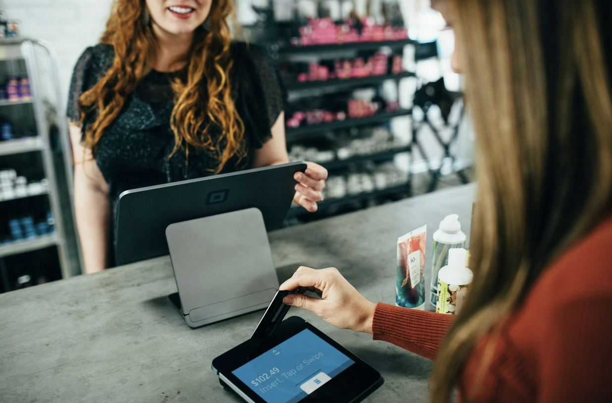 Customer making a credit card payment at checkout