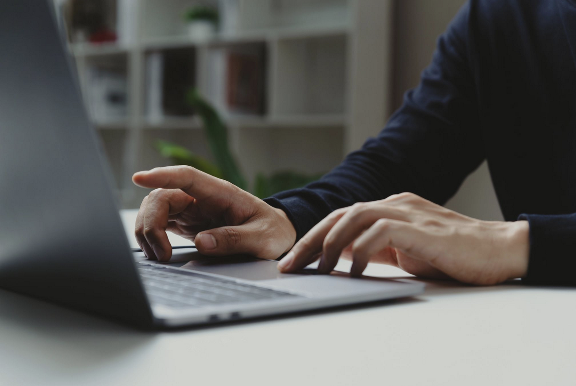 Person typing on a laptop computer