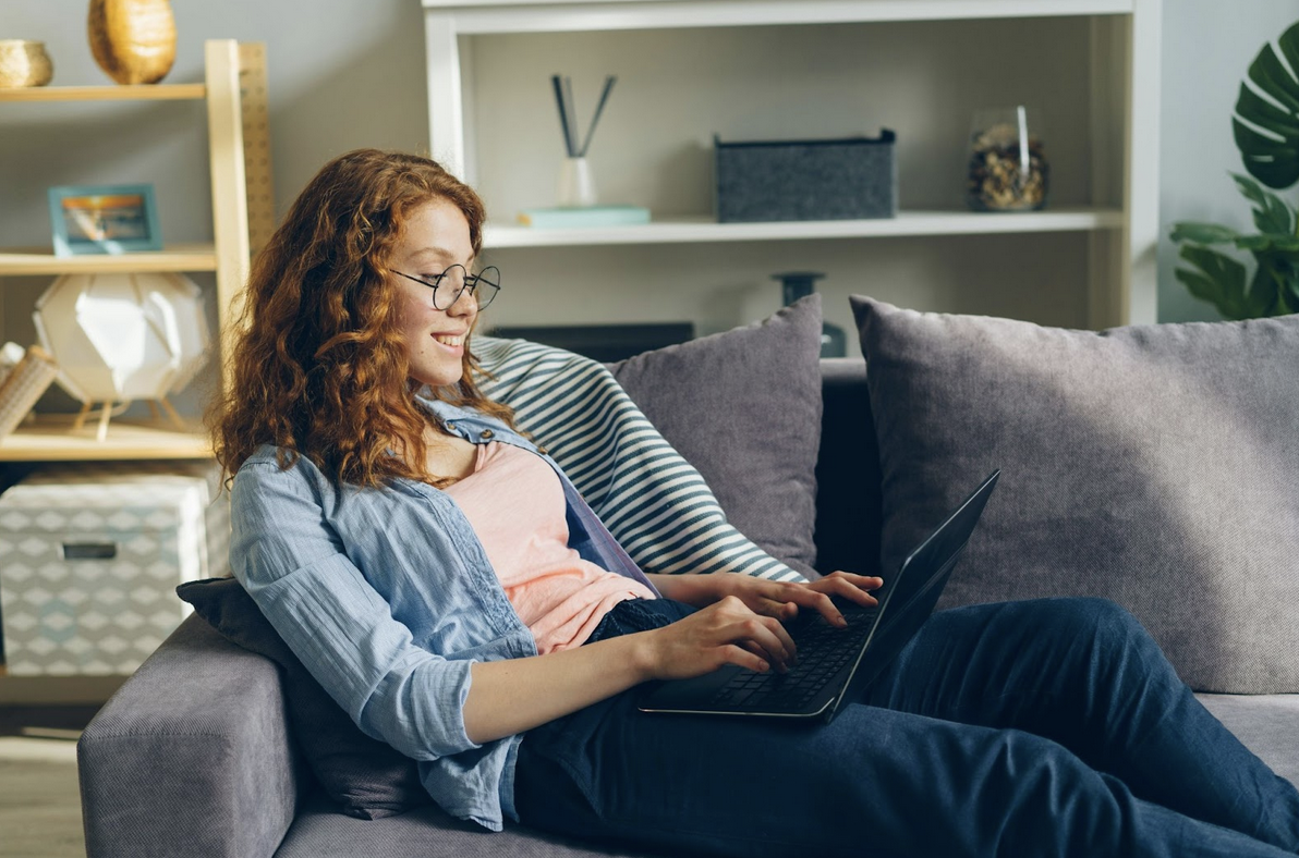 Student using laptop on the couch