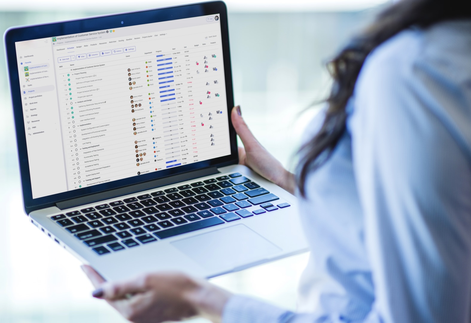 Remote worker using project management platform on laptop