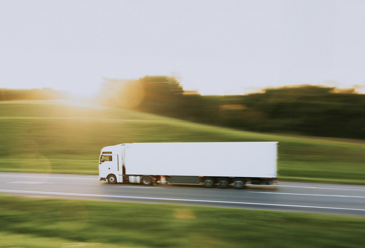 Semi-truck transporting freight on highway