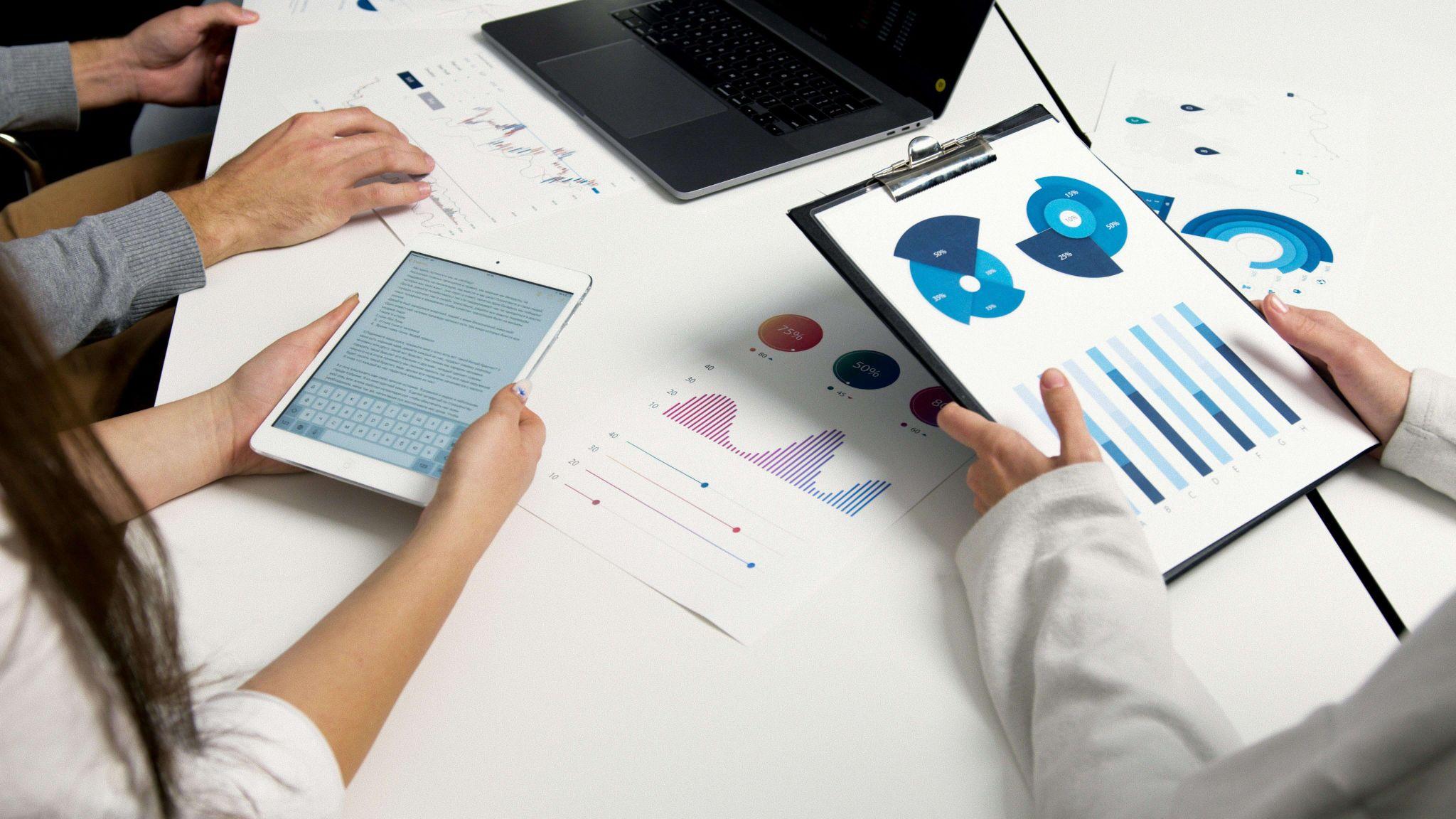Marketing team analyzing geospatial data and location-based insights to identify high-intent customer demand